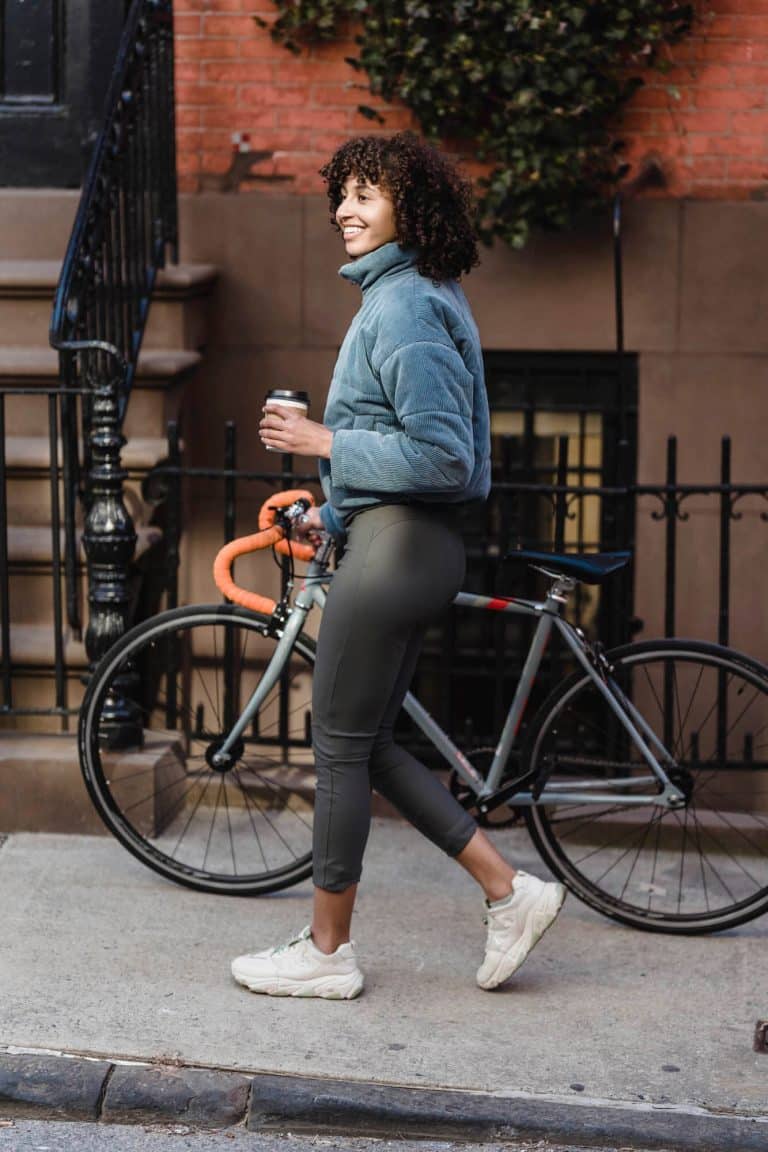 person walking with a bike Luxury Apartments Richmond VA lifestyle james at springline jamesatspringline14